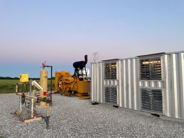 A miner working in a large mining farm, highlighting the scale and importance of maintaining optimal equipment performance.