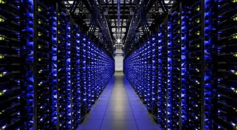 A miner inspecting an ASIC mining rig