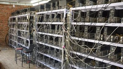 Expansive cryptocurrency mining farm featuring hundreds of mining rigs and cooling infrastructure