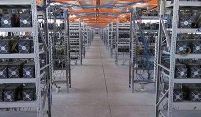 An aerial shot of a large-scale mining farm powered by solar panels, highlighting the scale and green energy aspect.